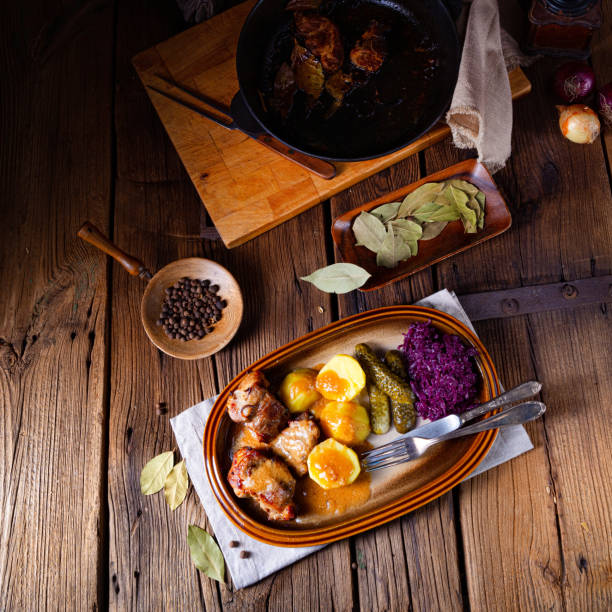 istock Rustic Snirtjebraten with red cabbage and cucumber 1302396837