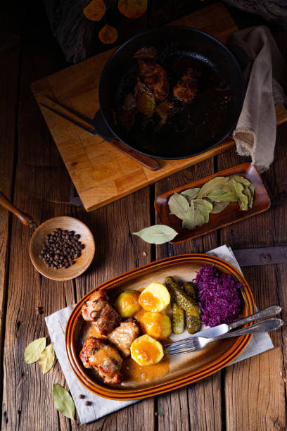 istock Rustic Snirtjebraten with red cabbage and cucumber 1302396888