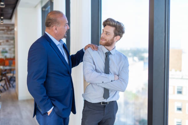 istock The boss congratulating his employee 1302400050