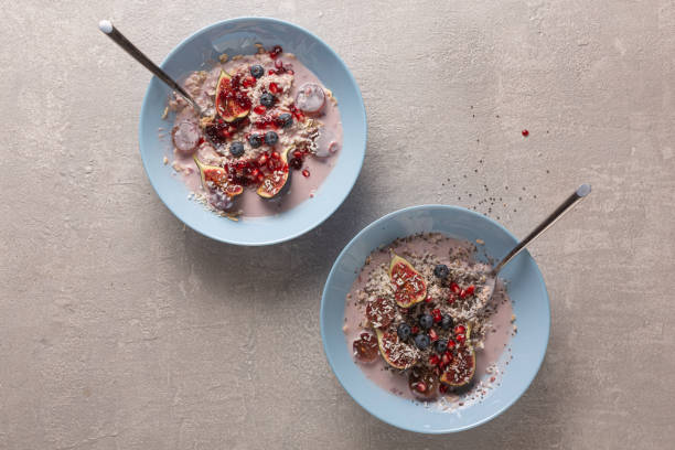 istock Healthy breakfast with oatmeal and fruit, top view 1302401953