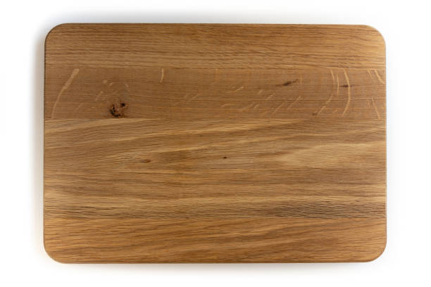 istock Used wooden chopping board isolated on white background. 1302403024