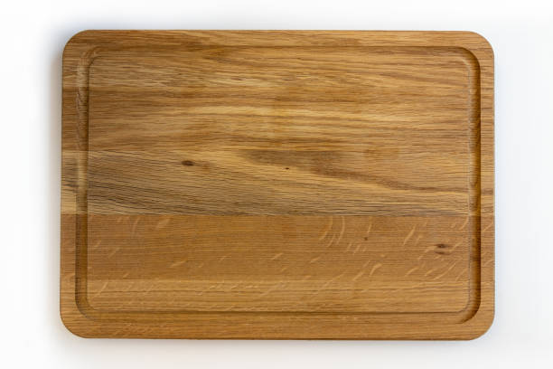 istock Used wooden chopping board isolated on white background. 1302403055