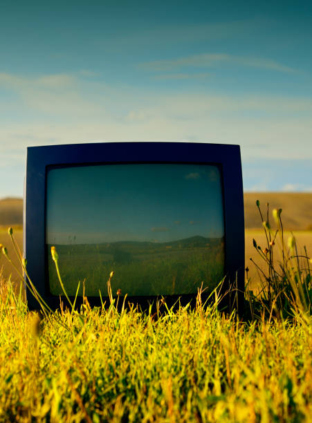 istock Old Television Abandoned in a Field. 1302403377