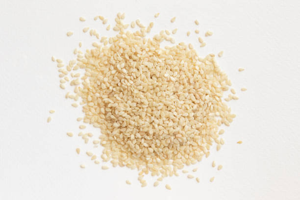 istock Sesame seeds isolated on white background top view. 1302405832