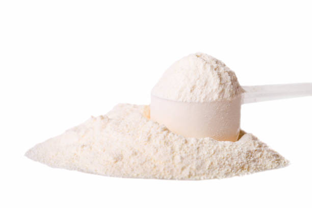 heap of white protein powder with measuring spoon - protein powder imagens e fotografias de stock