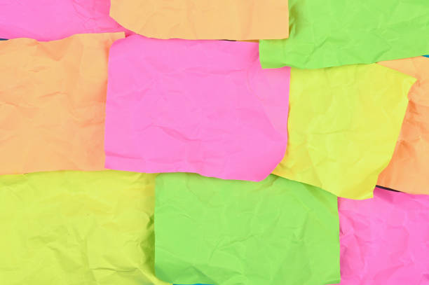 istock Multi-colored crumpled sheets of paper. 1302408119