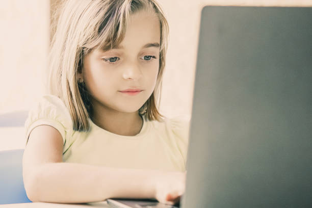 istock Caucasian pretty girl typing on laptop computer 1302408369