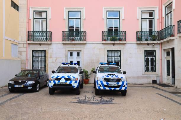 Police cars in Portugal Mitsubishi L200 and Toyota Hilux of Portugal Police. The full name of the Portugese force is Public Security Police (PSP). psp stock pictures, royalty-free photos & images