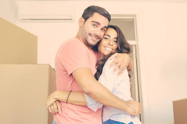 istock Happy couple moving into new apartment 1302412276