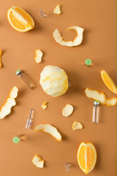 Ampoules with vitamin C for immunity and orange fruit.