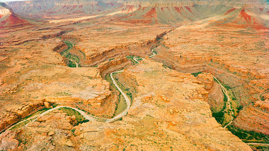Aerial view of dry Colorado River passing through valley amidst cliffs in Grand Canyon National Park, Arizona, USA.