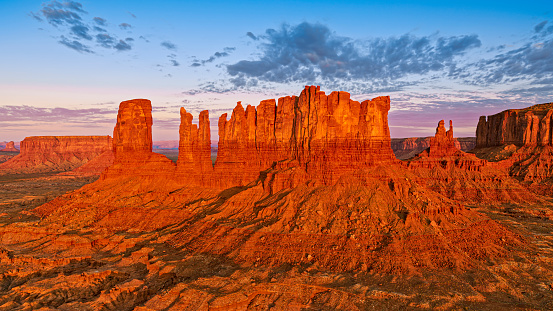 Aerial view of sandstone buttes in Monument Valley at sunrise, Arizona, USA.