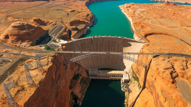 Aerial view Glen Canyon Dam and Glen Canyon Dam Bridge Aerial view of Glen Canyon Dam and Glen Canyon Dam Bridge over Lake Powell, Glen Canyon National Recreation Area, Coconino County, Page, Arizona, USA. lake powell stock pictures, royalty-free photos & images