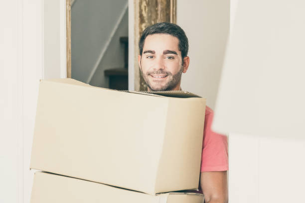 istock Happy man moving into new apartment 1302416534