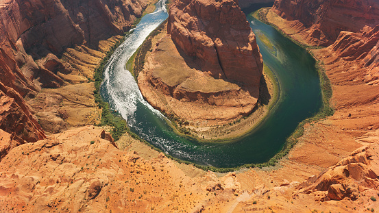 Aerial view of Colorado River passing by Horseshoe Bend, Glen Canyon National Recreation Area, Arizona, USA.