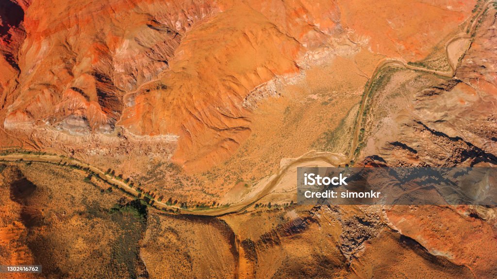 Overhead view of dry Colorado River and valley Aerial view of dry Colorado River passing through valley in Grand Canyon National Park, Arizona, USA. Desert Area Stock Photo