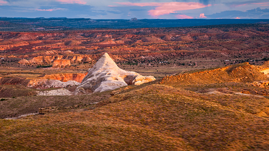 Aerial view of rock formation and cliffs against cloudy sky in Grand Canyon National Park, Arizona, USA.