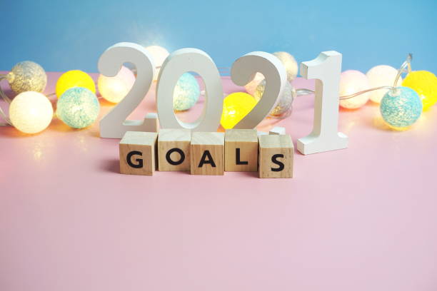 istock Goals 2021 word alphabet letters on blue and pink background 1302417075