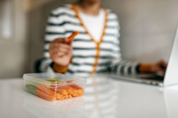 istock Young woman eat healthy snack 1302418323