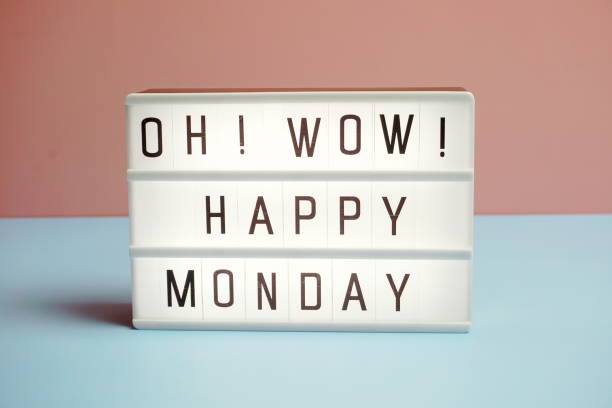 istock Happy Monday word in light box on blue and pink background 1302418433