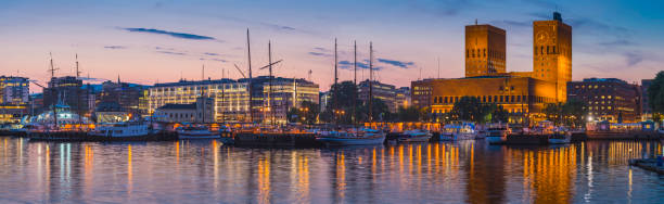 istock Oslo harbour waterfront panorama marina City Hall illuminated night Norway 1302419666