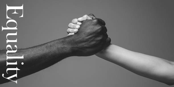 African and caucasian hands gesturing on gray studio background, tolerance and equality concept Support. African and caucasian hands gesturing on gray studio background. Tolerance and equality, unity, support, kindly coexistence together concept. Worldwide multiracial community. Flyer. racial equality photos stock pictures, royalty-free photos & images