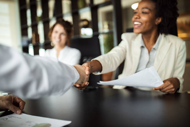 Employee people at modern office. Business woman making plans with somebody, shaking hands. reduction stock pictures, royalty-free photos & images