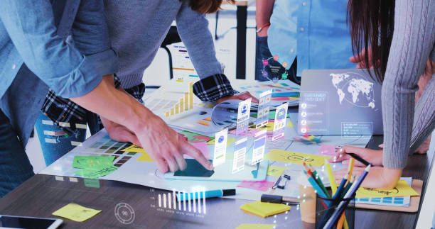 Close up ux developer and ui designer use augmented reality app brainstorming about mobile interface wireframe design on desk at modern office.Creative digital development agency Close up ux developer and ui designer use augmented reality app brainstorming about mobile interface wireframe design on desk at modern office.Creative digital development agency render stock pictures, royalty-free photos & images