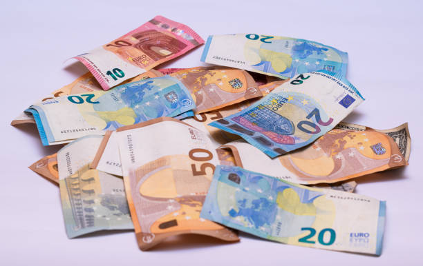 istock euro notes in a white background, fifty twenty, ten and five 1302425120