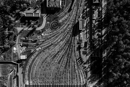 Public transport theme. aerial creative top view to metro depot heavy rail, subway, tube, metropolitan or underground. Black and white square design composition. Abstract representation of industry