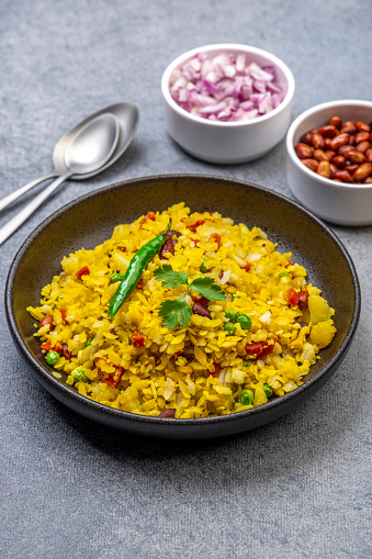 famous Indian breakfast aloo poha  in a plate