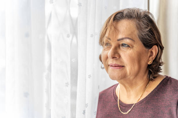 istock Senior Hispanic woman headshot 1302429284