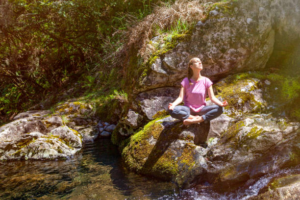 Woman doing yoga in the wild