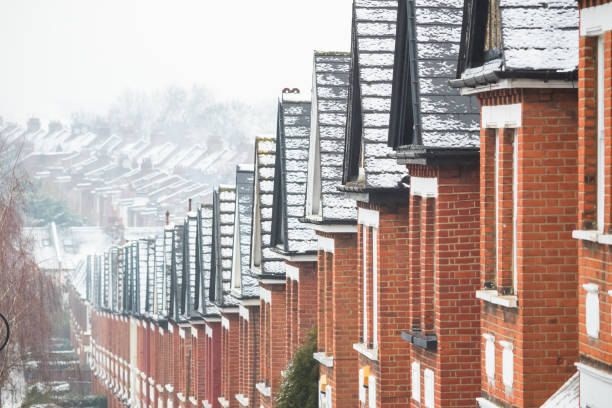 istock Identical terraced houses covered by snow in Crouch End, London 1302431046