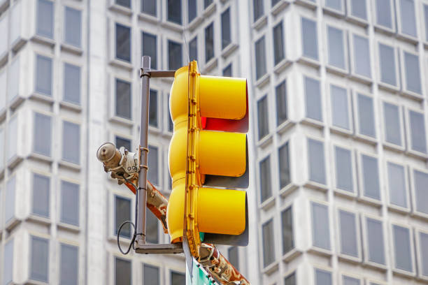 istock Bright yellow traffic lights on the windows pattern background 1302432515