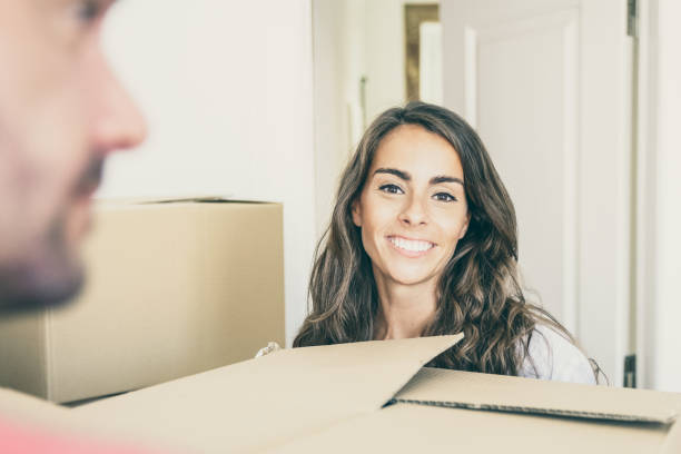 istock Positive joyful couple moving into new house 1302433392
