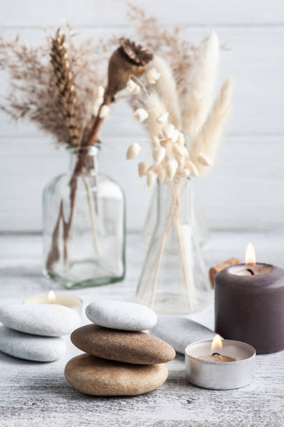istock Lit aroma candle and dry flowers 1302433702