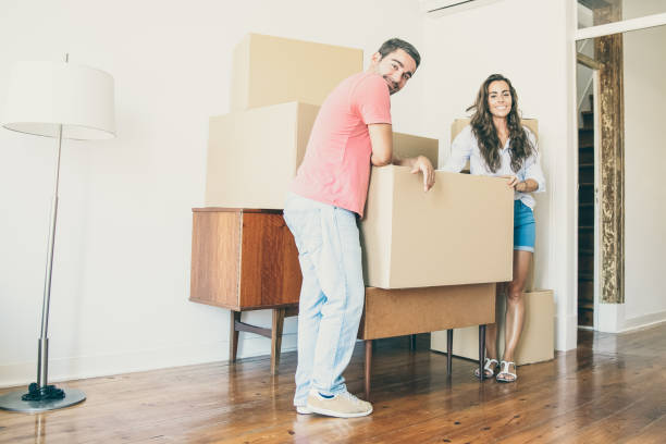 istock Young couple moving into new flat 1302433973