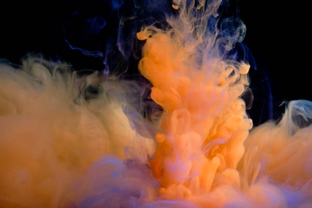 istock Fluid art. Abstract background. Orange flow on black. 1302435176