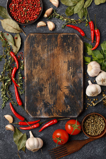 istock Frame composition made of vegetables and herbs with cutting board 1302435965