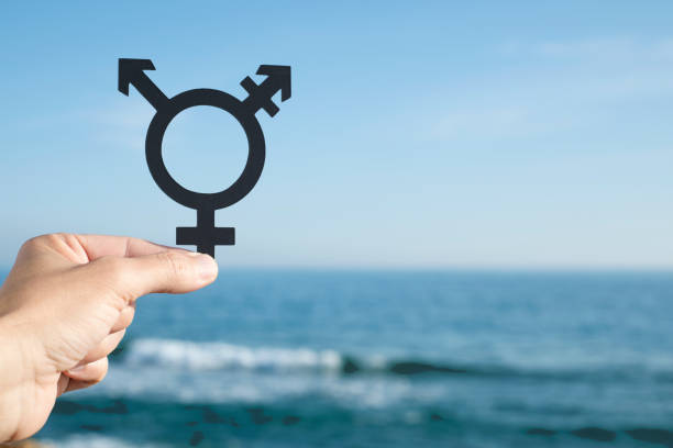 istock person showing a transgender symbol 1302439040