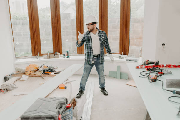 istock Construction worker man in safety helmet among tools at home repair 1302439099