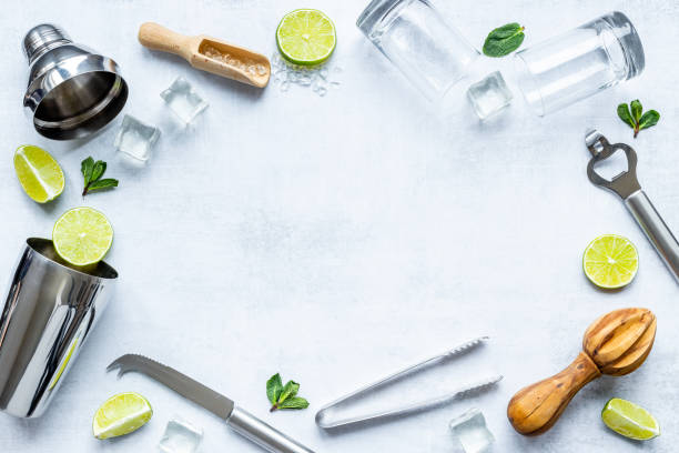 istock Frame of bar utensils and tools for Mojito cocktail - shaker, lime and ice 1302439840