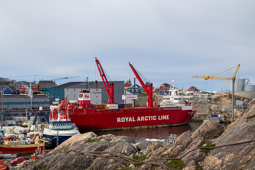 Ilulissat, Greeland - July 11, 2018: A Royal Arctic Line container ship anchored in Ilulissat harbor.