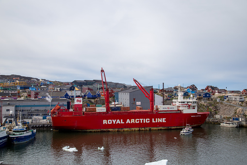 Ilulissat, Greeland - July 11, 2018: A Royal Arctic Line container ship anchored in Ilulissat harbor.
