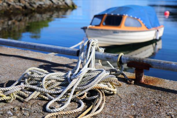 Fishing boat rope Norway coast in summer. Fishing harbor rope at Karmoy island. haugaland photos stock pictures, royalty-free photos & images