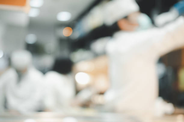 istock Abstract blurry Japanese counter with chef preparing food 1302441551