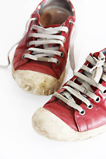 istock old worn red sports sneakers 1302442749
