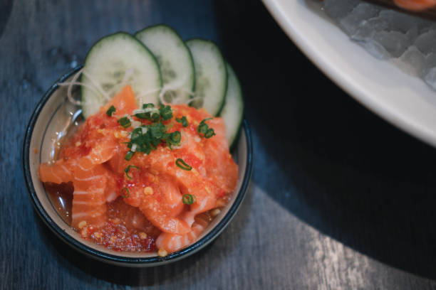 istock Spicy sashimi salad Salmon in white bowl 1302442757
