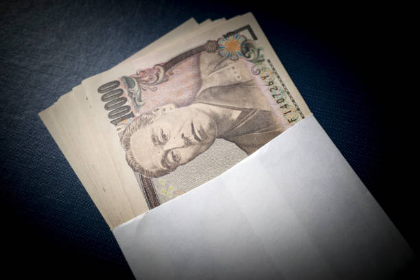istock Japanese ten-thousand yen bills in an envelope 1302442950